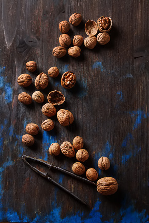Group of ripe walnuts Nutcracker. Dark wood backgroundの写真素材