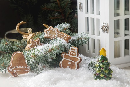 Merry christmas holiday decoration background with ginger man snowflakes snowman and tree cookies dry orange. Light wooden table. Space for textの写真素材