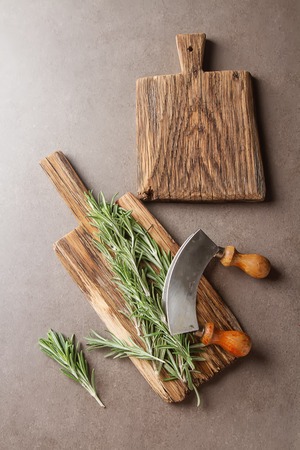 Mix of fresh Italian herbs from garden on an old table. Rosemary, temyan, oregano. Dark backgroundの写真素材