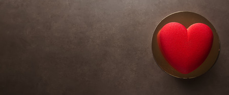 Delightful, luxury, romantic mousse cake in the form heart. Valentine's Day on February 14.の写真素材