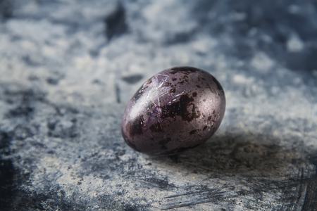 Multi-colored easter eggs.  quail. Dark background. Spring holiday.の写真素材