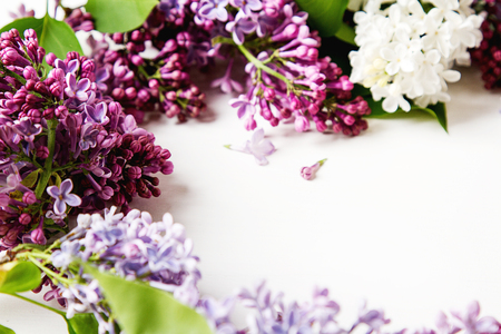 Spring flowers. Lilac flowers on white wooden background. Top view, flat lay.の写真素材