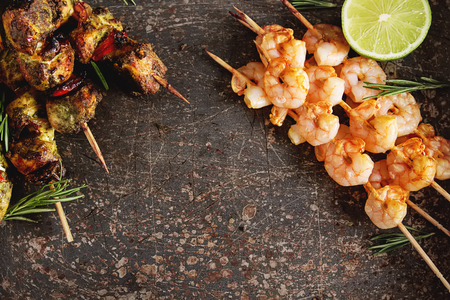 Mini barbecue with tuna and shrimp on a wooden skewer, grill, bbq. Simple background. Healthy food. Lifestyleの写真素材