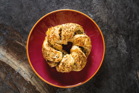 Greek pie spanakopita with spinach, cheese. Simple dark background. Healthy food. Lifestyle