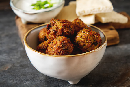 Middle Eastern traditional dishes. Falafel with sour cream. Vegetarian foodの写真素材