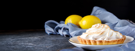 French dessert. Tartlet with lemon. Dark backgroundの写真素材