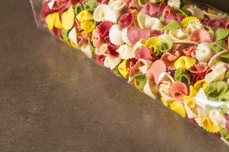 Multicolored Italian pasta. Delicious dinner for children. Pasta the boatの写真素材
