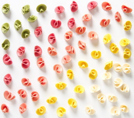 Multicolored Italian pasta. Delicious dinner for children. Pasta the boat. White backgroundの写真素材