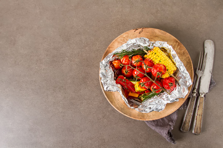 Grilled vegetables with salt and spices. Dark background. Fast food in the summer. A vegan picnicの写真素材