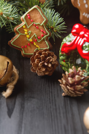 Merry christmas holiday decoration background with ginger man snowflakes snowman and tree cookies dry orange. Dark wooden table. Space for textの写真素材