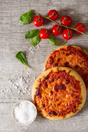 Mini margarita pizza. Italian food. Simple background. Fast foodの写真素材