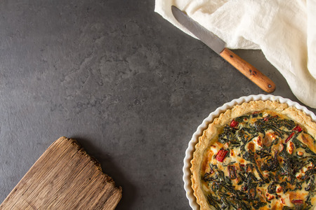 Homemade cheese Quiche egg for brunch with spinach and chard.の写真素材