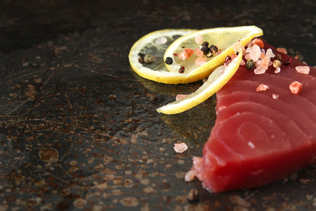 Steak of tuna for grilling. Dark background. Seafoodの写真素材