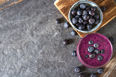Fresh juicy blueberry smoothies in the glass. Simple background. Healthy food. Detox. Lifestyleの写真素材