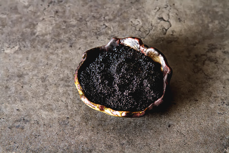 Black sturgeon caviar in a ceramic bowl. Dark backgroundの写真素材