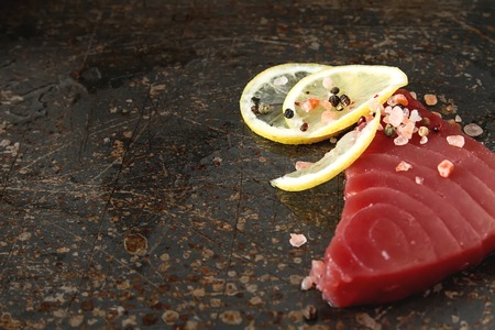 Steak of tuna for grilling. Dark background. Seafoodの写真素材