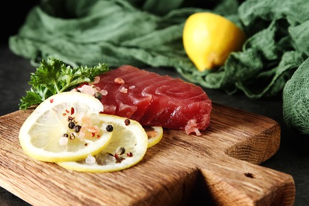 Steak of tuna for grilling. Dark background. Seafoodの写真素材