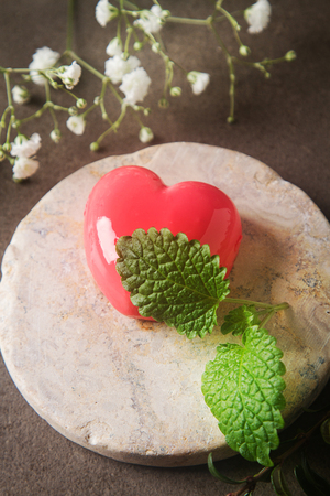Delightful, luxury, romantic mousse cake in the form heart. Valentine's Day on February 14.の写真素材