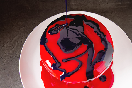 The process of preparing a mousse cake. Dark backgroundの写真素材