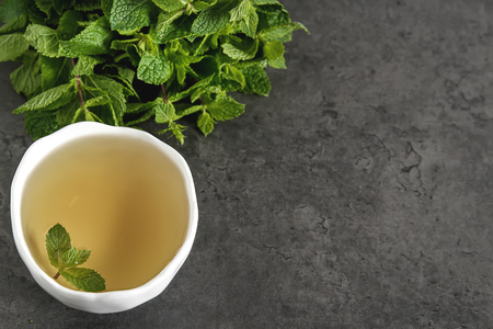 Fresh mint leaves in tea. Italian herbs. Dark backgroundの写真素材