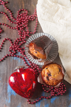 Blueberry muffins and fresh berries. Tasty dessert. Light breakfast. St. Valentine's Day. Dark backgroundの写真素材