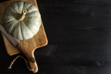 Autumn meal. Ripe pumpkins. Holiday Hallow. Dark backgroundの写真素材