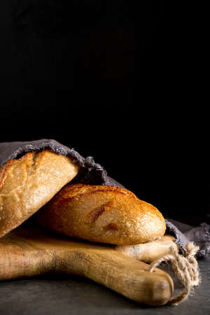 Homemade Italian bread. Fresh bakery. Dark background