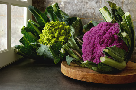 Cauliflower green and purple. Dark background. Vegetarian foodの写真素材