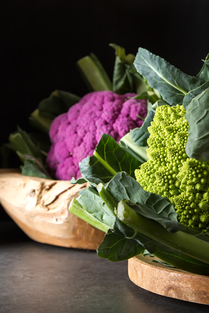 Cauliflower green and purple. Dark background. Vegetarian foodの写真素材