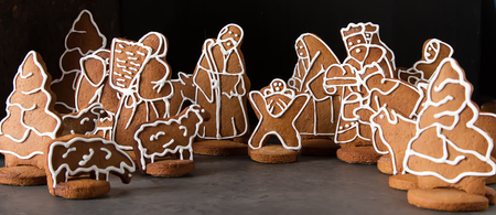 Christmas Betlem decoration, gingerbread. The Birth of Christ. Dark background