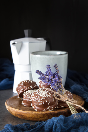 marchmallow covered with chocolate with black hot coffee. birthday, dark backgroundの写真素材