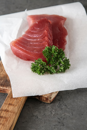 Steak of tuna for grilling. Dark background. Seafoodの写真素材