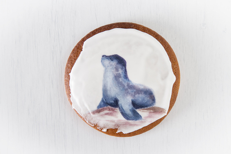 Ginger honey gingerbread cookies with a picture of sea animals. Light backgroundの写真素材