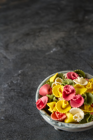 Multicolored Italian pasta. Delicious dinner for children. Pasta the boatの写真素材