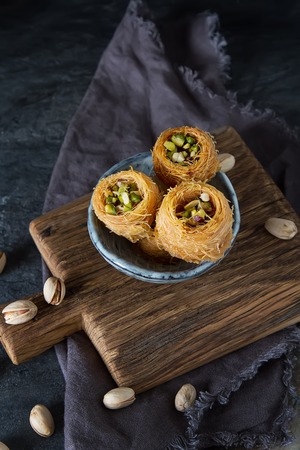 Traditional arabic dessert baklava with pistachios. Dark backgroundの写真素材