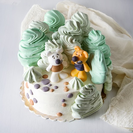 Birthday cake with honey mastic. White backgroundの写真素材