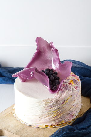 Birthday cake with pink caramel. White backgroundの写真素材