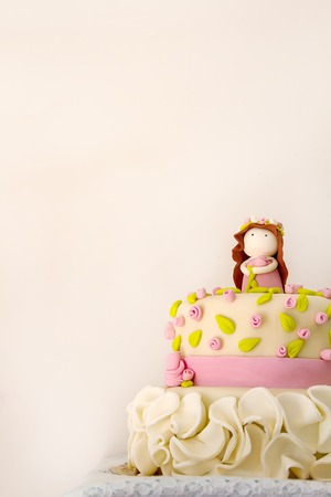 Cake for the girl on her birthday. Sweet gift. Feeling a holiday. Light backgroundの写真素材