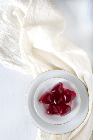 lollipops in the form of hearts. Sweets for lovers. Light backgroundの写真素材