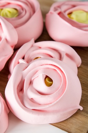 meringue in the form of a pink flower. Light backgroundの写真素材