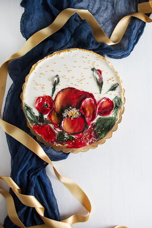 A cake for a holiday with flowers. Light backgroundの写真素材