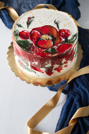 A cake for a holiday with flowers. Light backgroundの写真素材