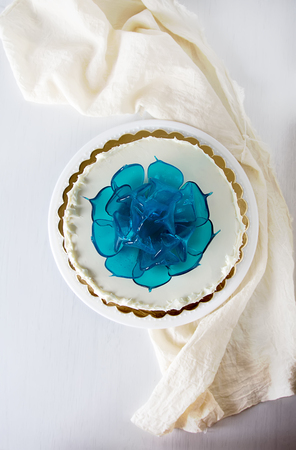 A cake for a holiday with flowers. Light backgroundの写真素材