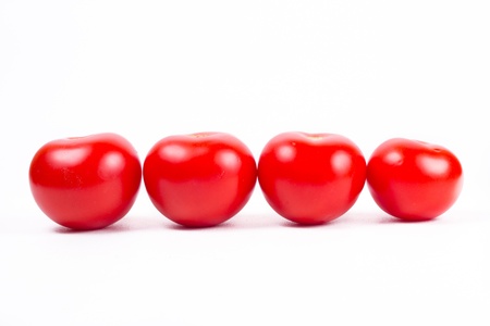 four tomato isolated on white background