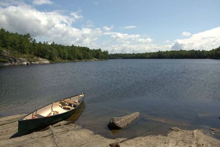 An image of a canoe in the Honey Harbour area of Georgian Bay, on a beautiful sunny day.の写真素材