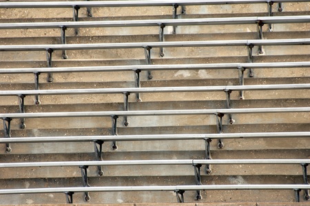 Background image of metal bleachers at sports arena   Seats and steps fill image の写真素材