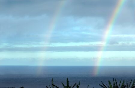 Double rainbow appears after a brief shower on the Big Island of Hawaii   The end of the rainbow...