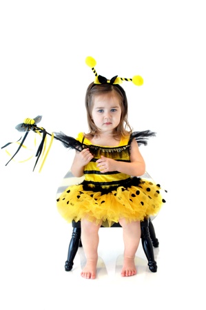Little girl is dressed up as a bumble beeの写真素材
