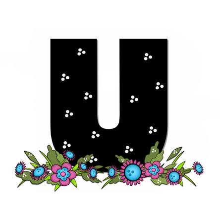 The letter U, in the alphabet set "Country Lane Two" is pink with black outline.  Letter sits on arrangement of country flowers in pink and blue.の写真素材