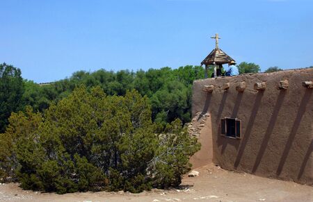 Enactor sits on top of the El Rancho del las Golondrinas, meeting house waiting to ring the bell for the beginning of a parade.の写真素材